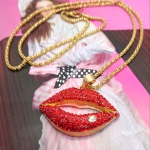 Red Crystal Lips Pendant on a Gold Slinky Chain Necklace
